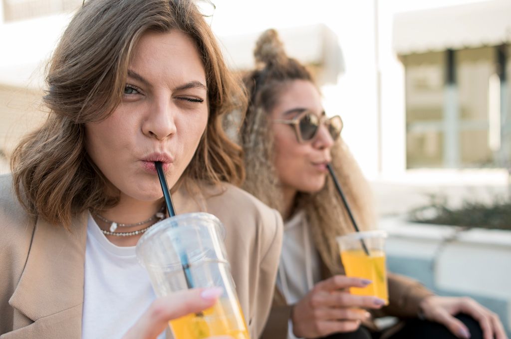 beautiful-young-women-drinking-orange-juice.jpg