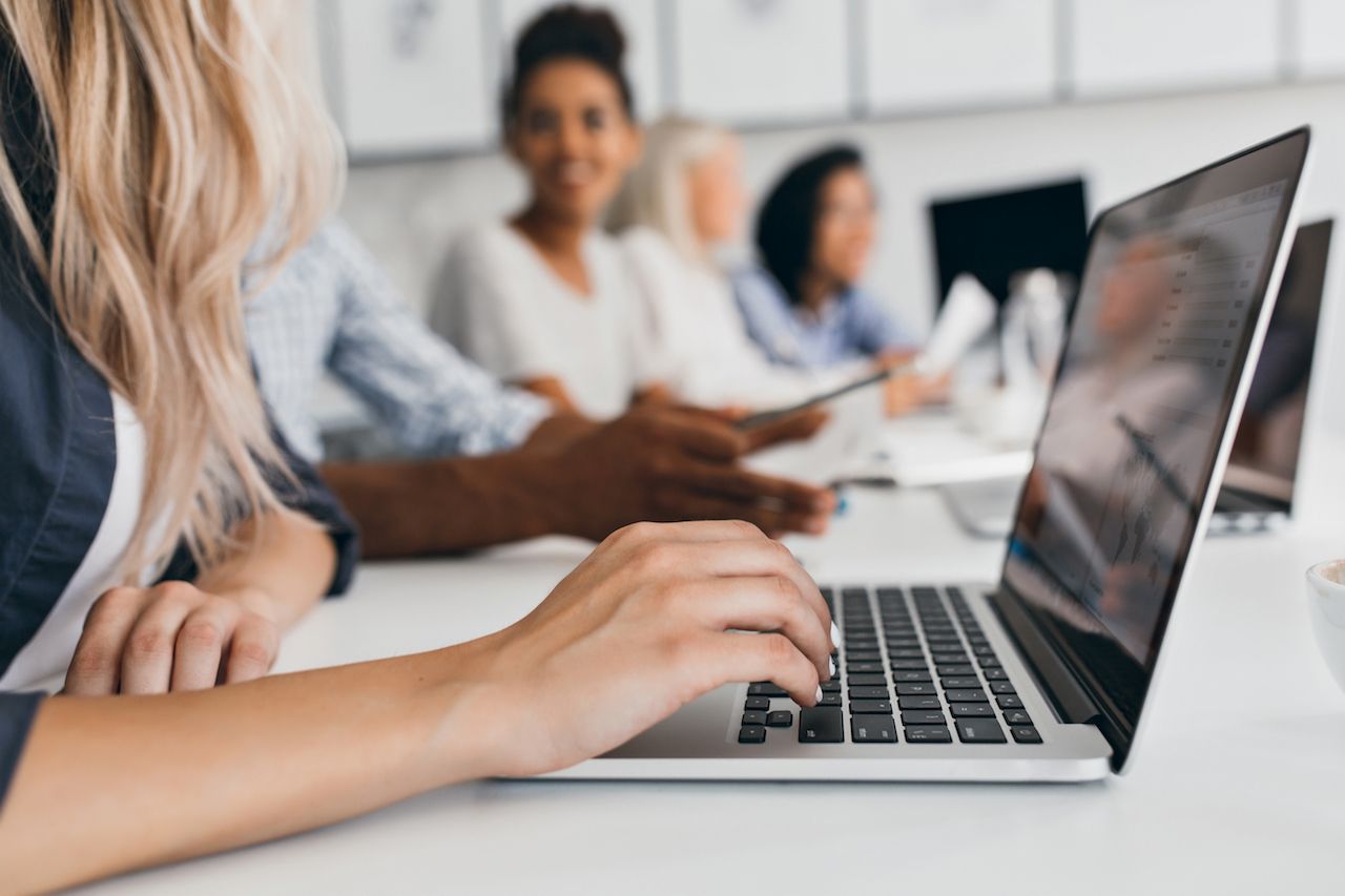 blonde-woman-with-elegant-hairstyle-typing-text-keyboard-office-indoor-portrait-international-employees-with-secretary-using-laptop.jpg