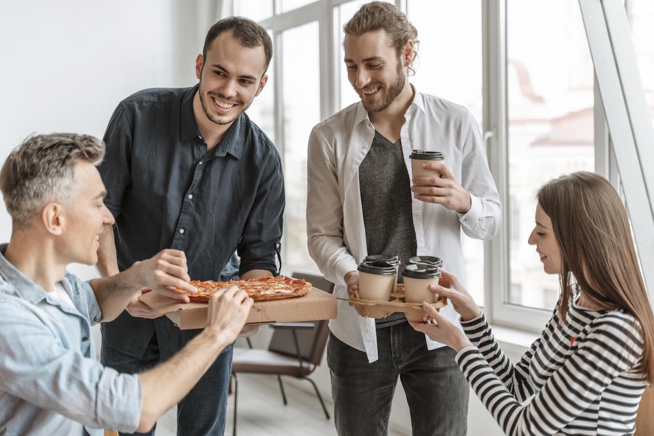 businesspeople-lunch-break-eating-pizza.jpg