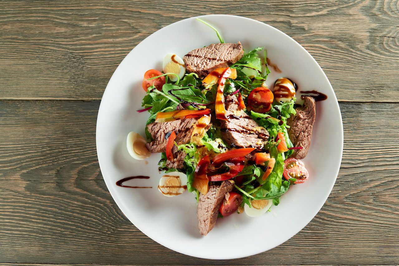 close-up-delicios-vegetable-salad-including-veal-slices-quail-eggs-cherry-tomatoes-tasty-restaurant-meal-with-light-red-white-wine-champagne.jpg