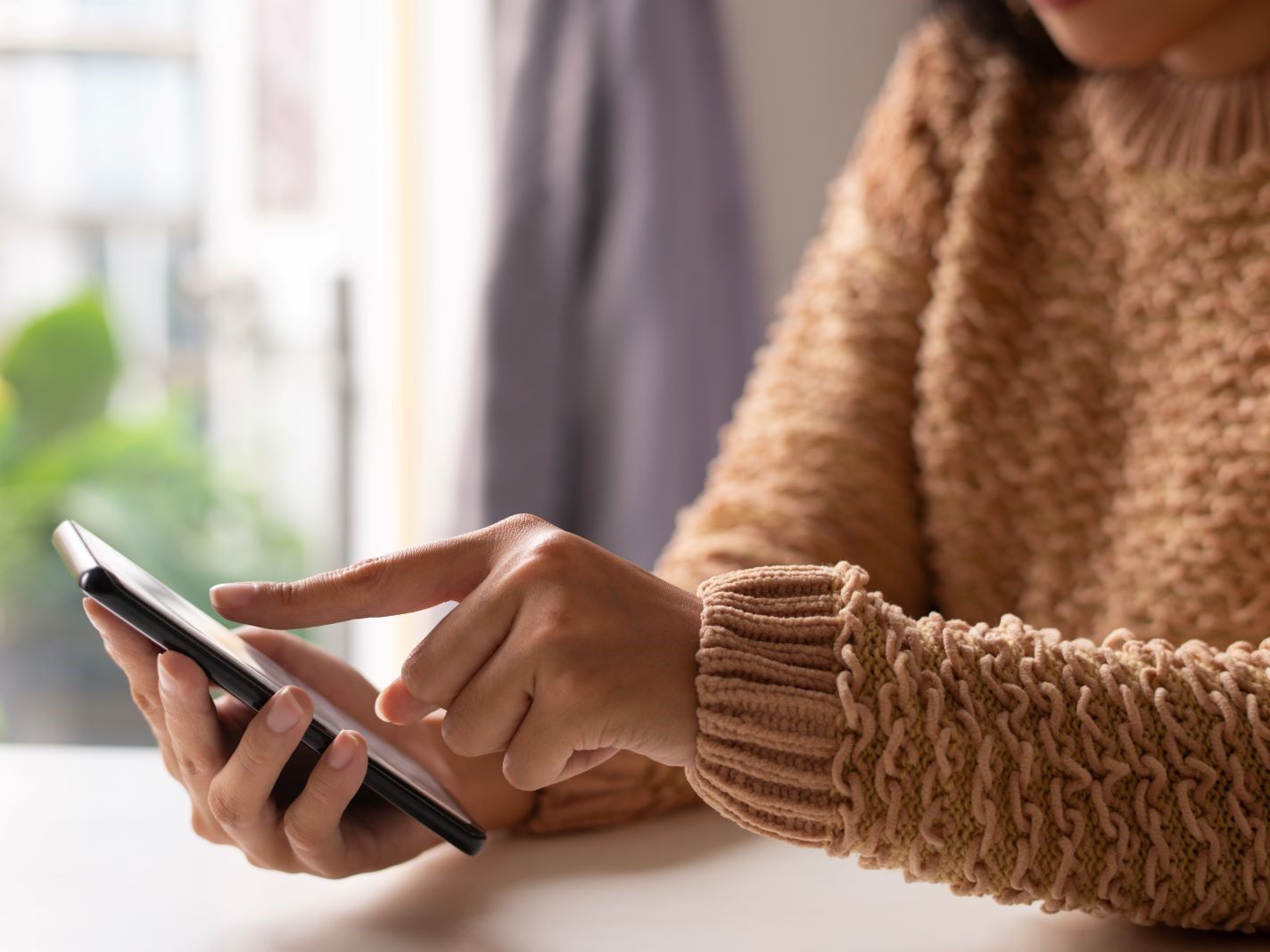close-up-girl-sweater-viewing-online-information.jpg