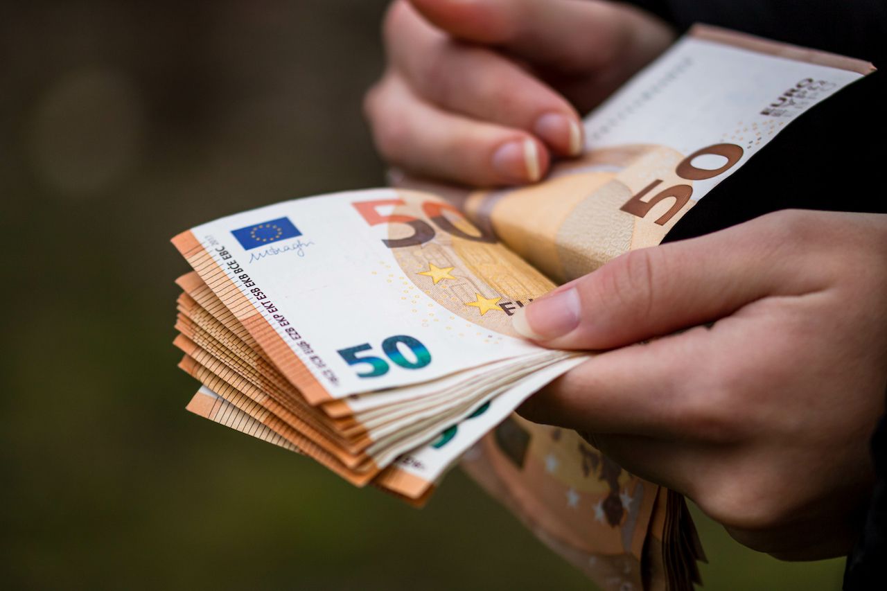 closeup-female-hands-counting-euro-banknotes-world-money-inflation-economy-concept (3).jpg