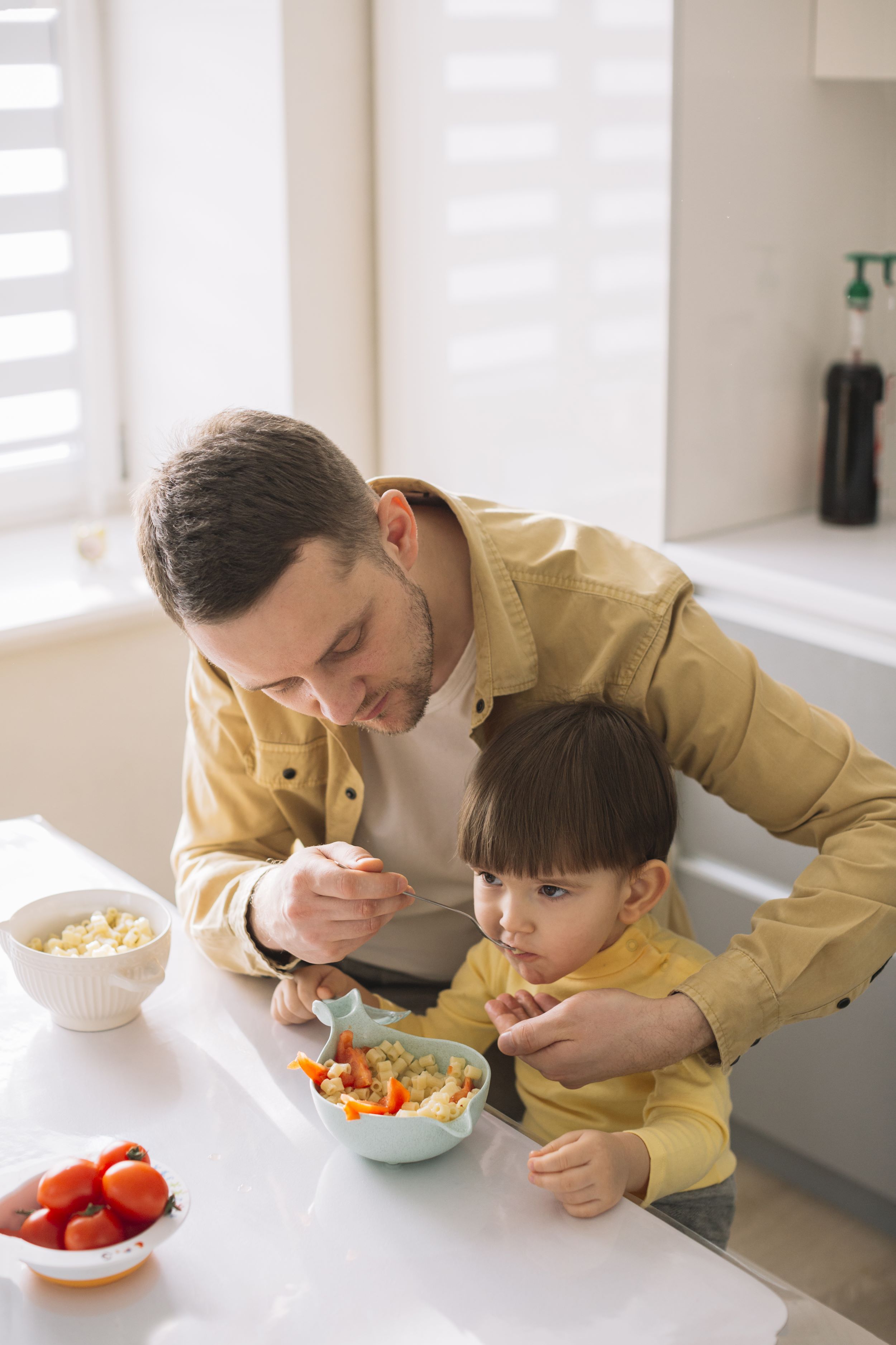 cute-little-child-his-father-eating-high-view.jpg
