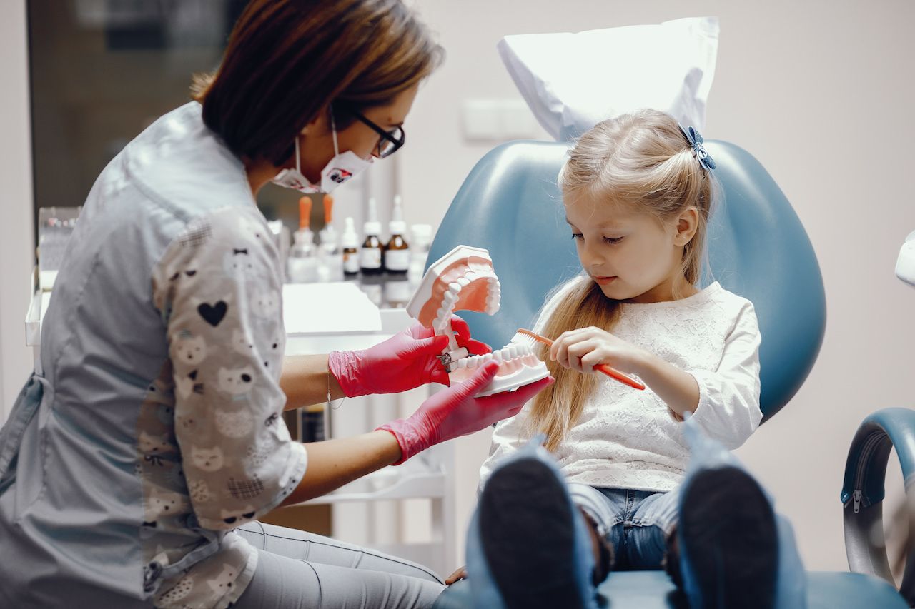 cute-little-girl-sitting-dentist-s-office.jpg