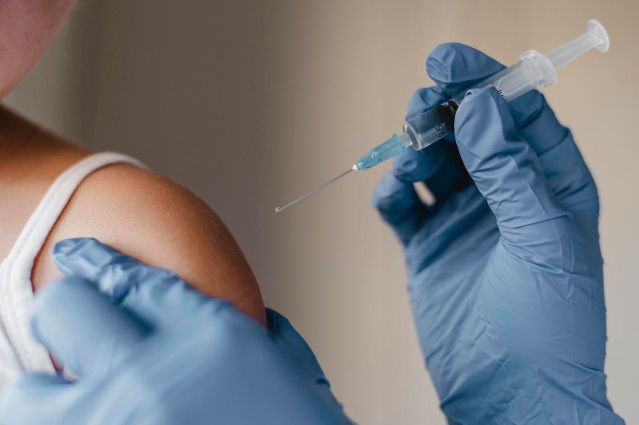 doctor-with-gloves-administering-little-child-vaccine.jpg