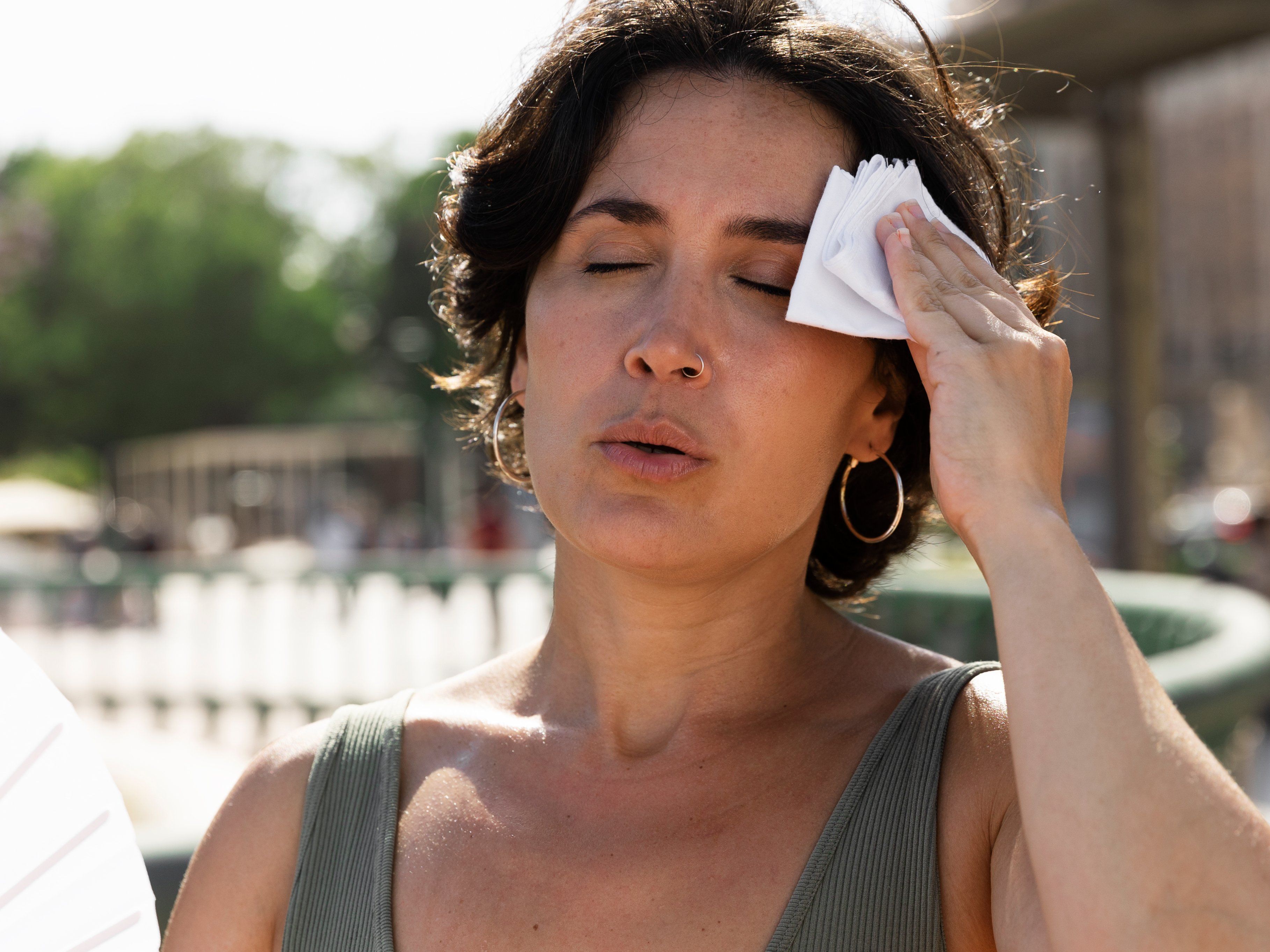 elder-woman-struggling-with-high-temperature (1).jpg