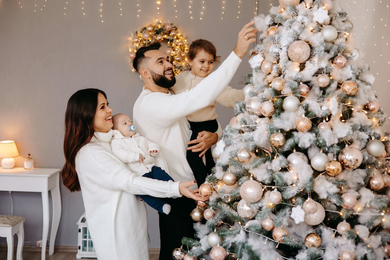 family-decorates-christmas-tree-together-home.jpg