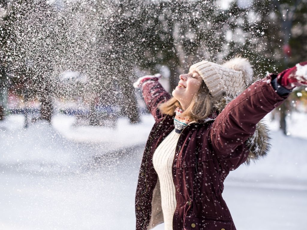 girl-playing-with-snow-park-portrait-happy-girl-wearing-snowy-winter-clothes_1024x768.jpg