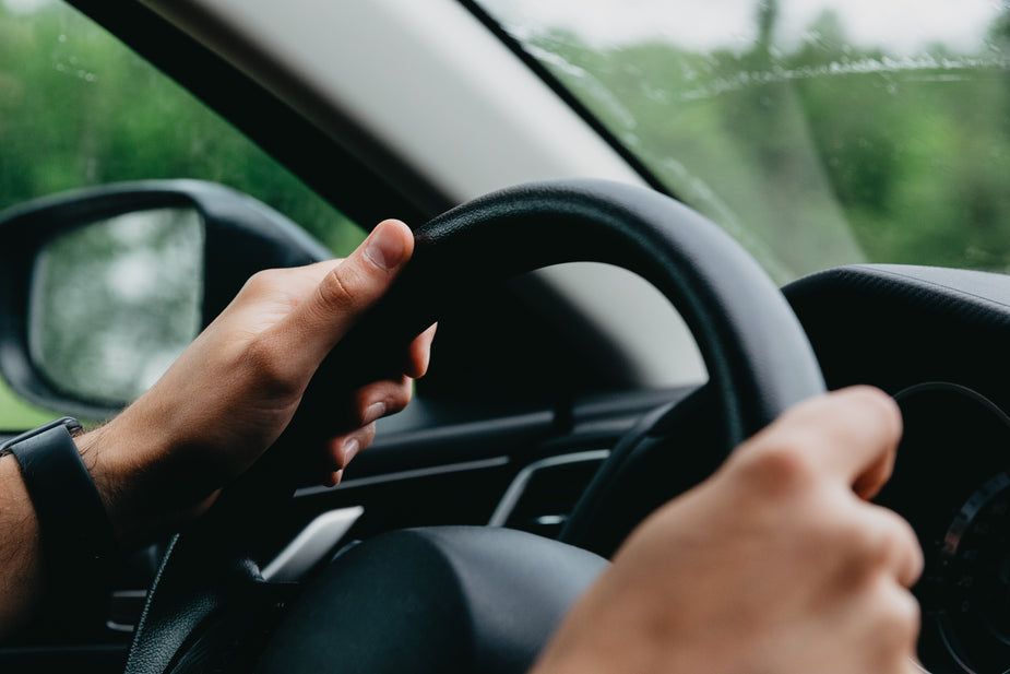 hands-grasping-a-steering-wheel.jpg
