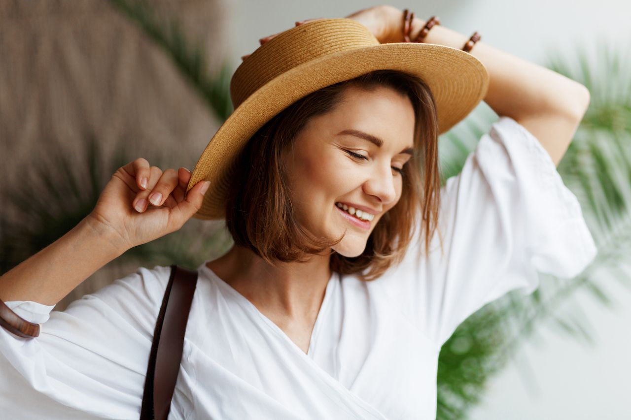 indoor-close-up-portrait-elegant-pretty-woman-straw-hat-white-dress-posing-home.jpg