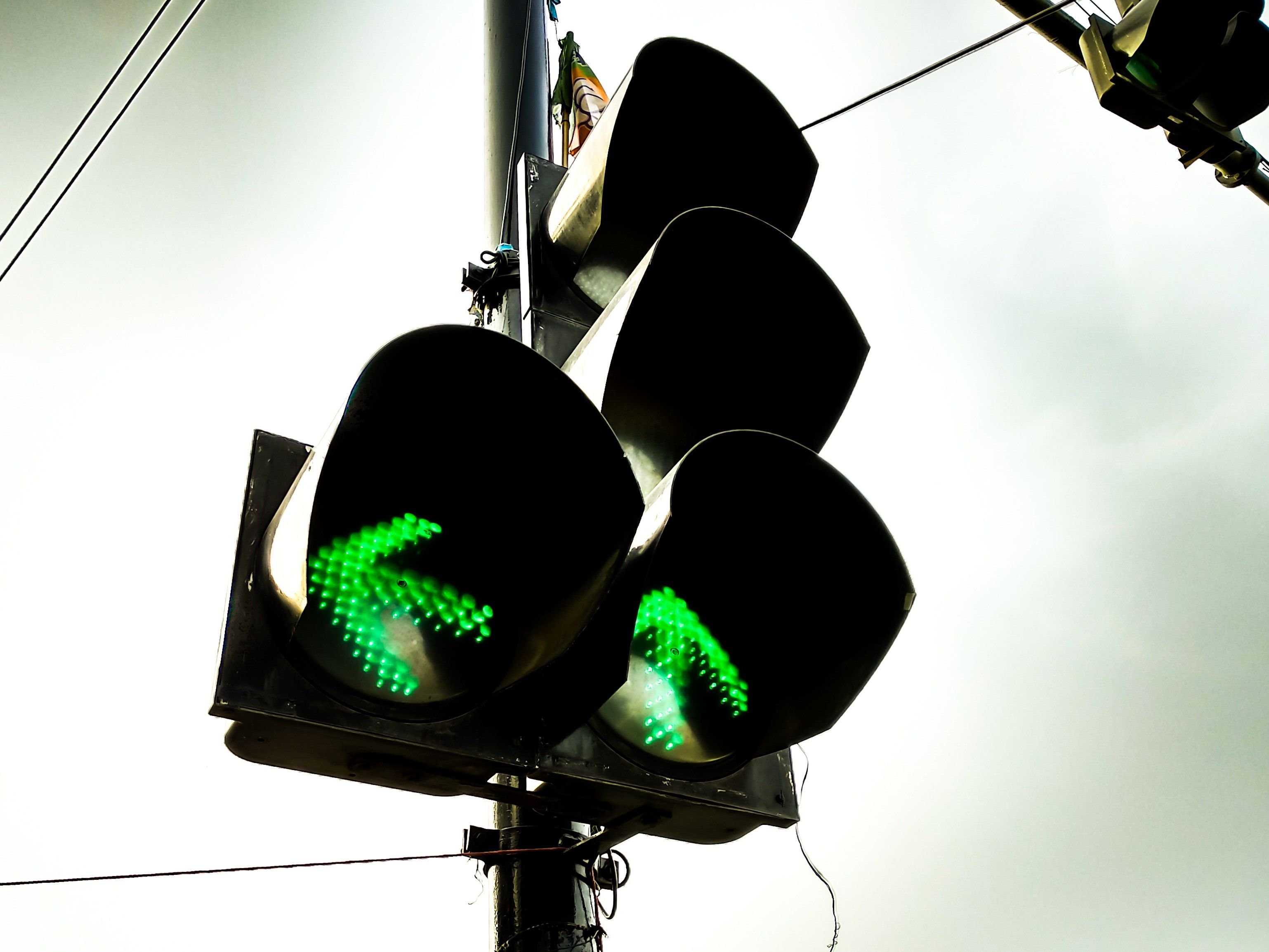 low-angle-view-road-signal-against-sky.jpg