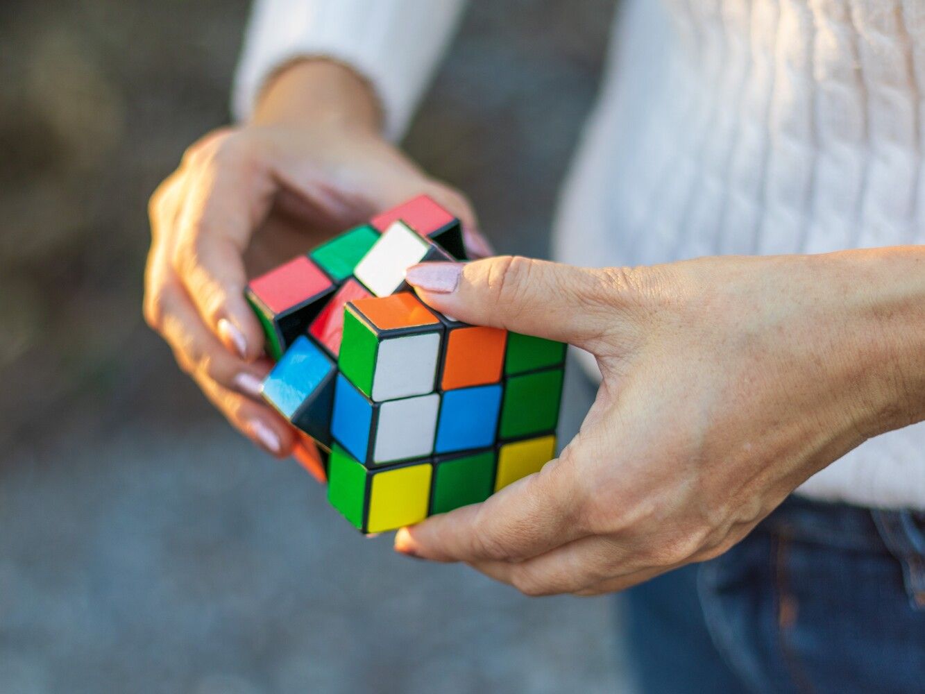 midsection-woman-playing-with-puzzle-cube (1).jpg