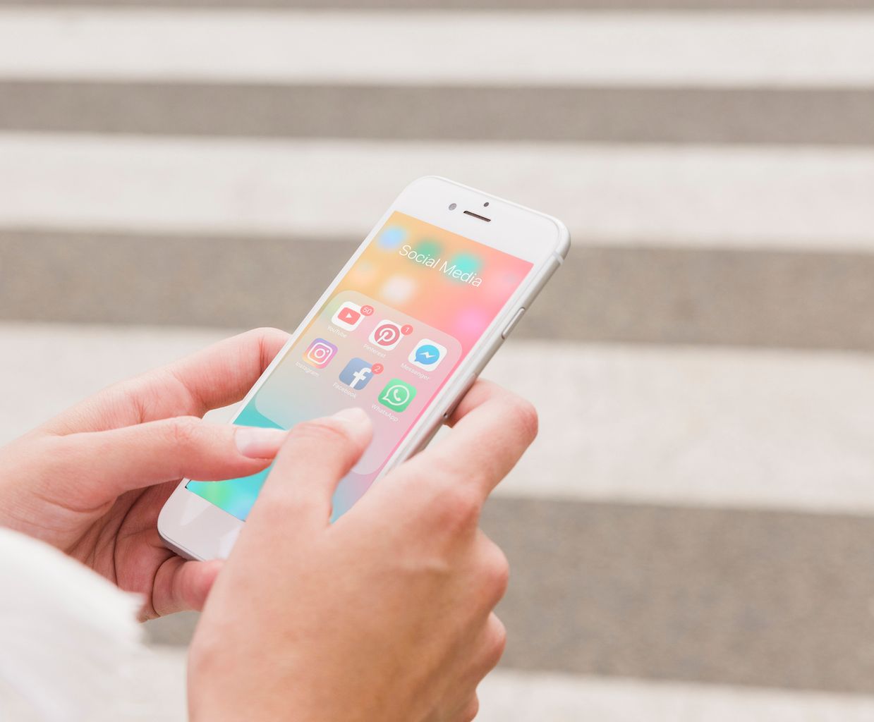 person-s-hand-holding-cellphone-with-social-media-notifications-screen.jpg