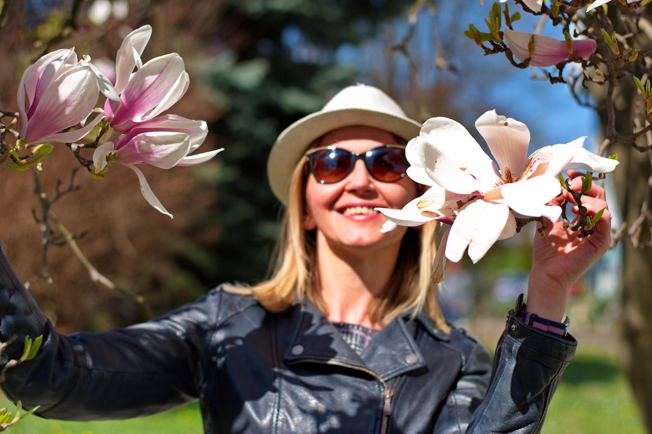 portrait-young-woman-with-magnolia-blooming.jpg