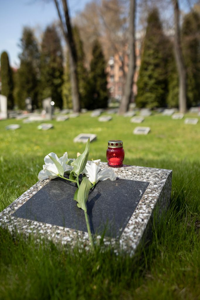 view-gravestone-with-flowers-candle.jpg