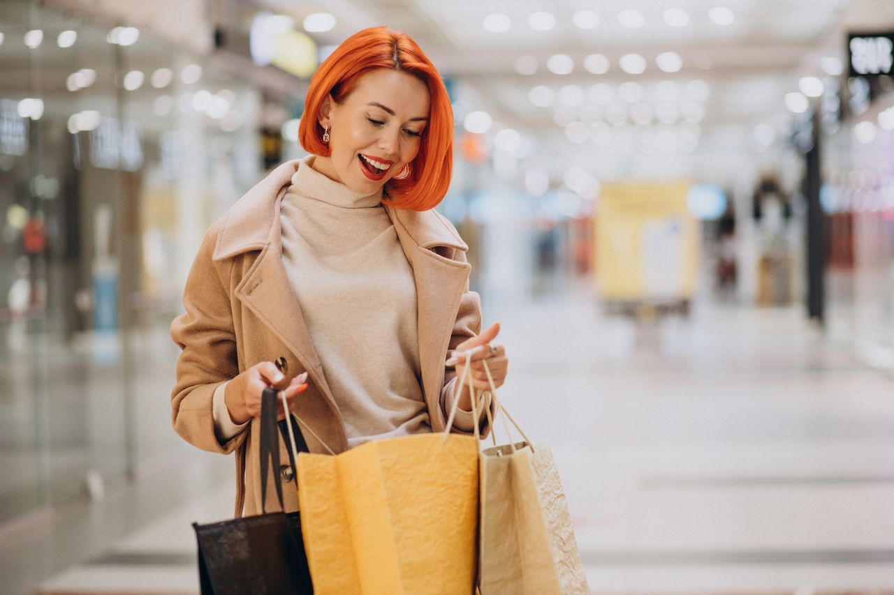 woman-with-shopping-bags-making-purchases-mall.jpg