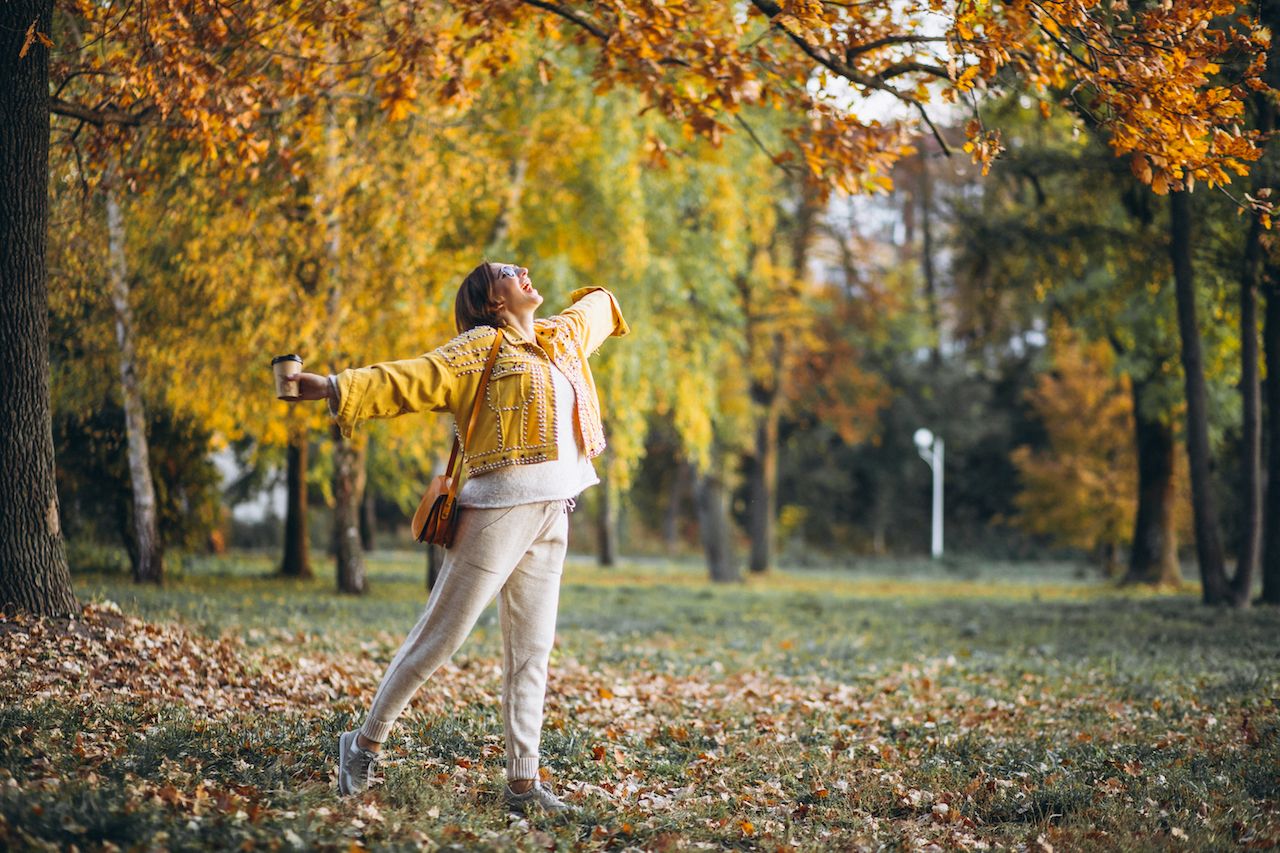young-woman-autumn-park-drinking-coffee-3.jpg